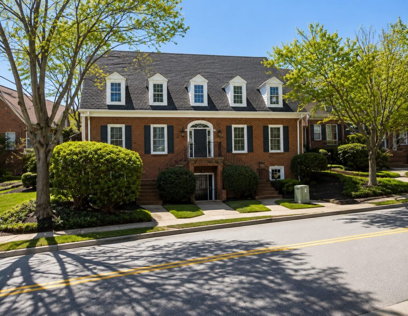 Red brick house with dormer windows