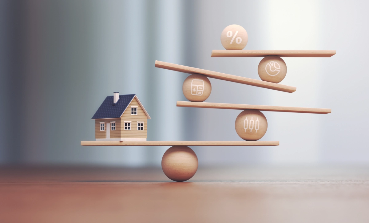 Scales with house and finance icons