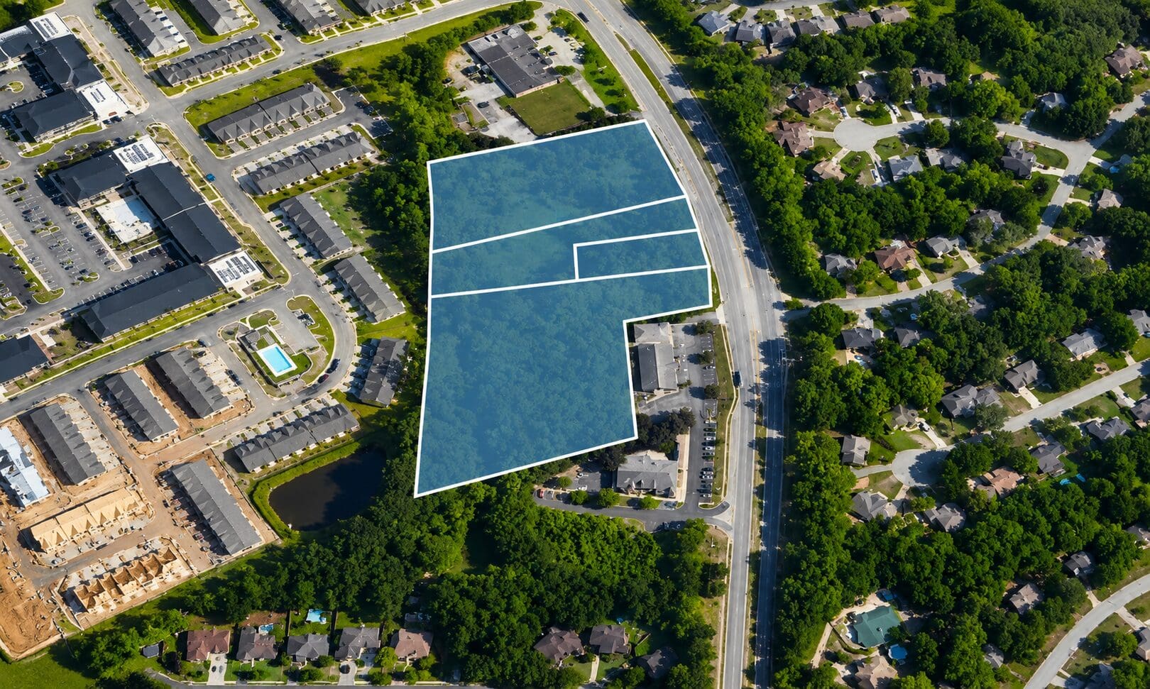 Aerial view of subdivided wooded parcel