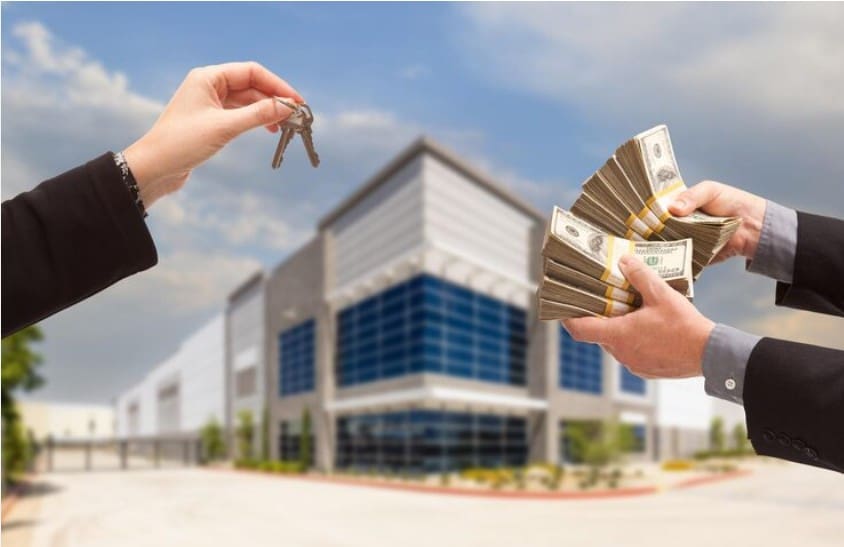 Commercial property sale: keys and bundled cash