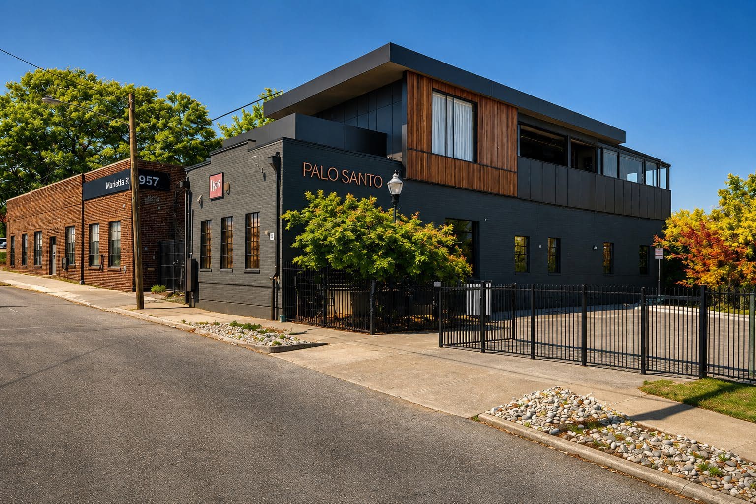 Modern black building with Palo Santo sign